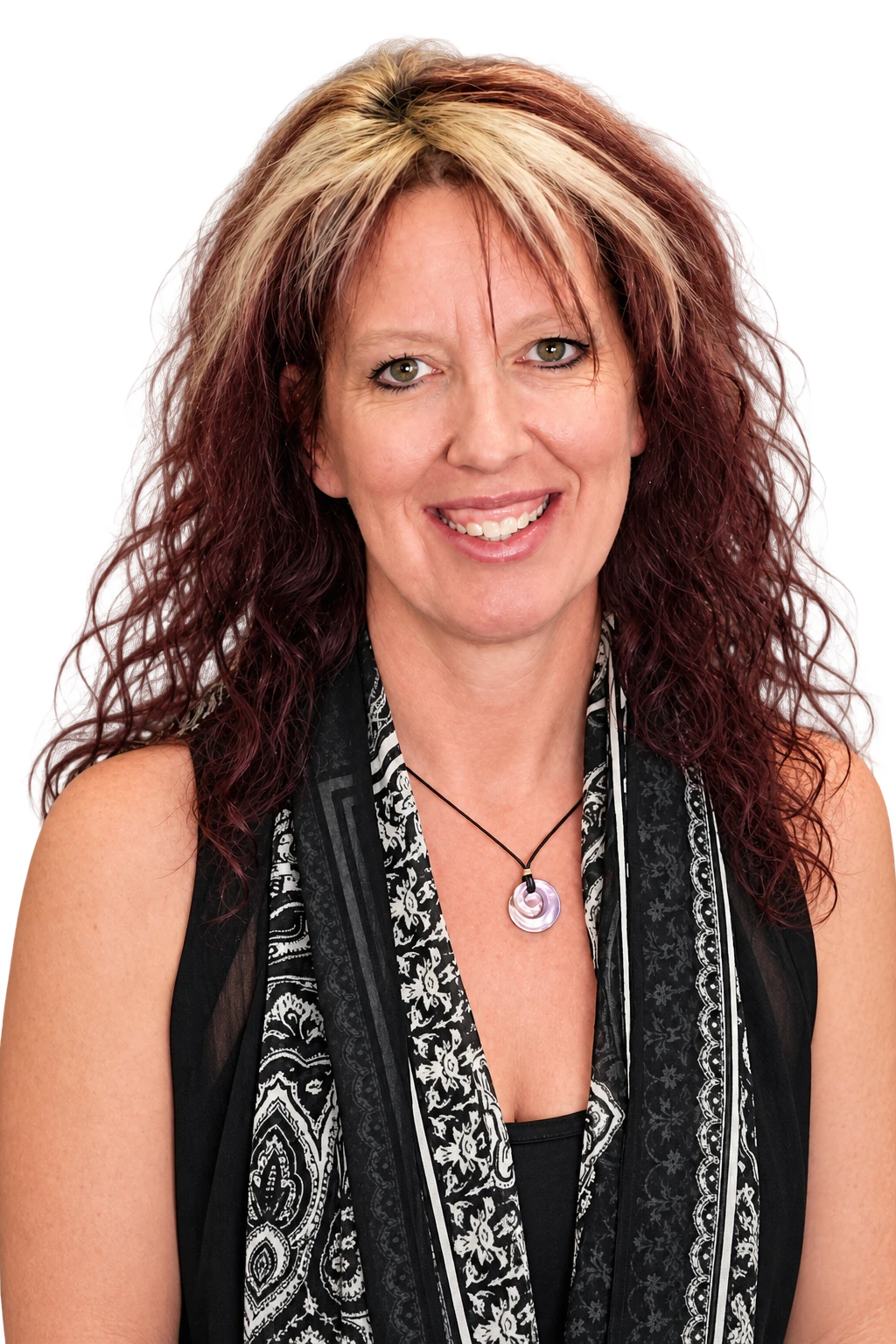 ReNae Schramm smiling, wearing a black patterned scarf